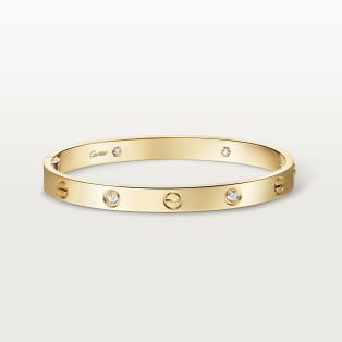 <span class='lovefont'>A </span> bracelet, classic model, 4 diamonds, one screw closure Yellow gold, diamonds